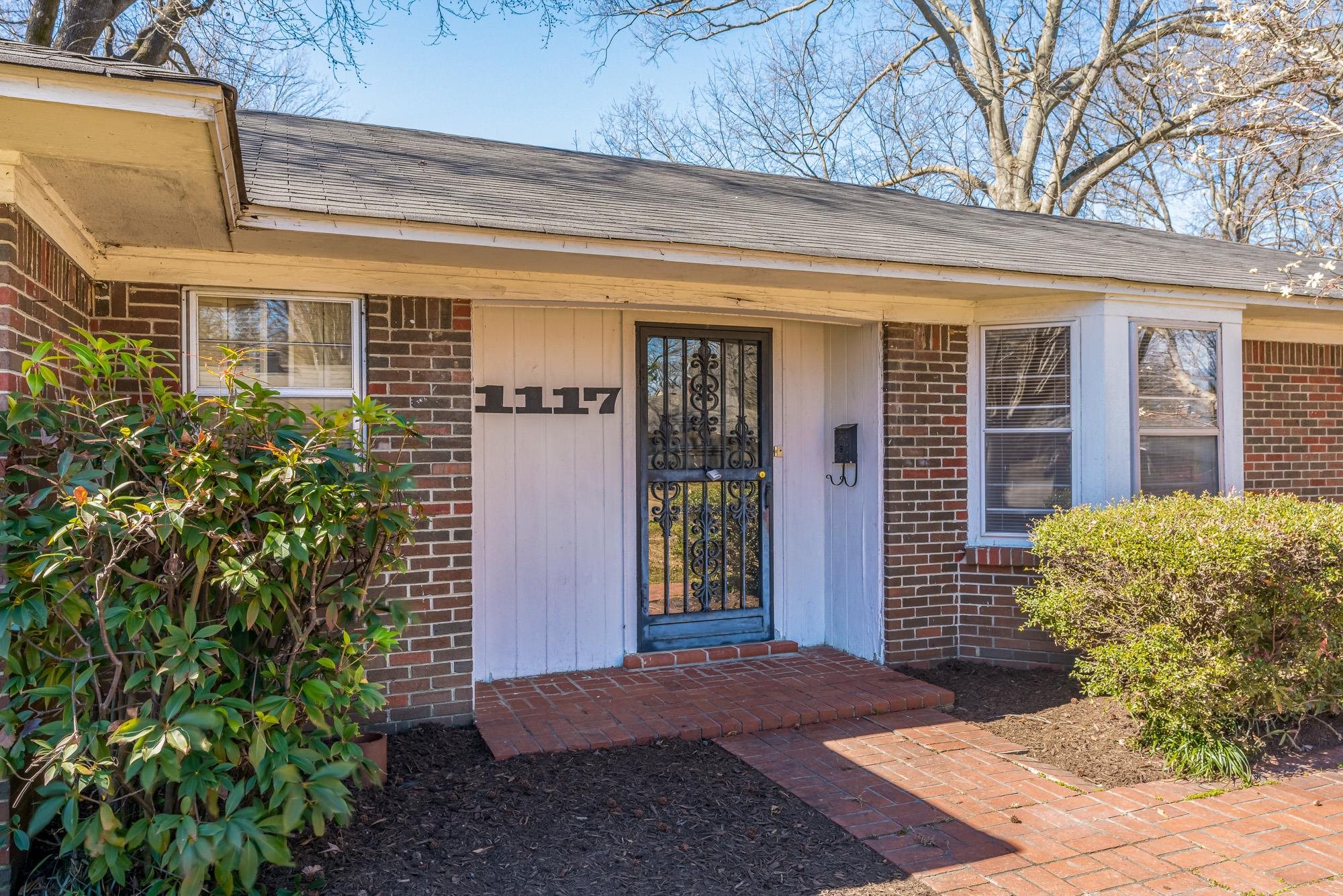 1117 South Perkins Road Memphis, TN 38117 - Photo 3 of 24 a front view of a house with a yard