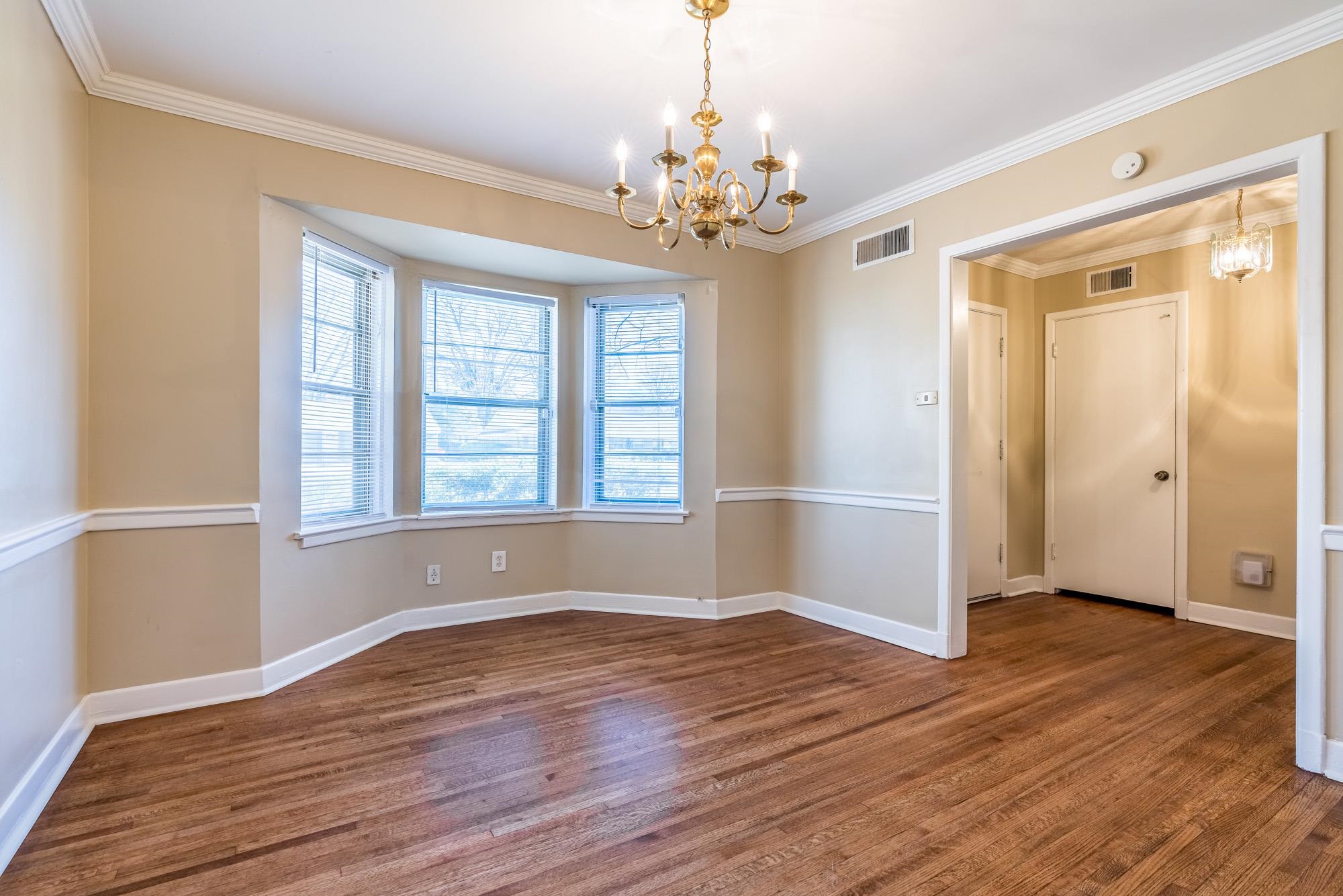 1117 South Perkins Road Memphis, TN 38117 - Photo 7 of 24 a view of livingroom with window and wooden floor