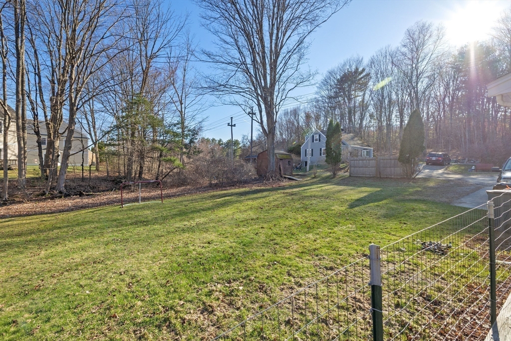 38 Brook Street Georgetown, MA 01833 - Photo 32 of 42 a view of a yard with large trees