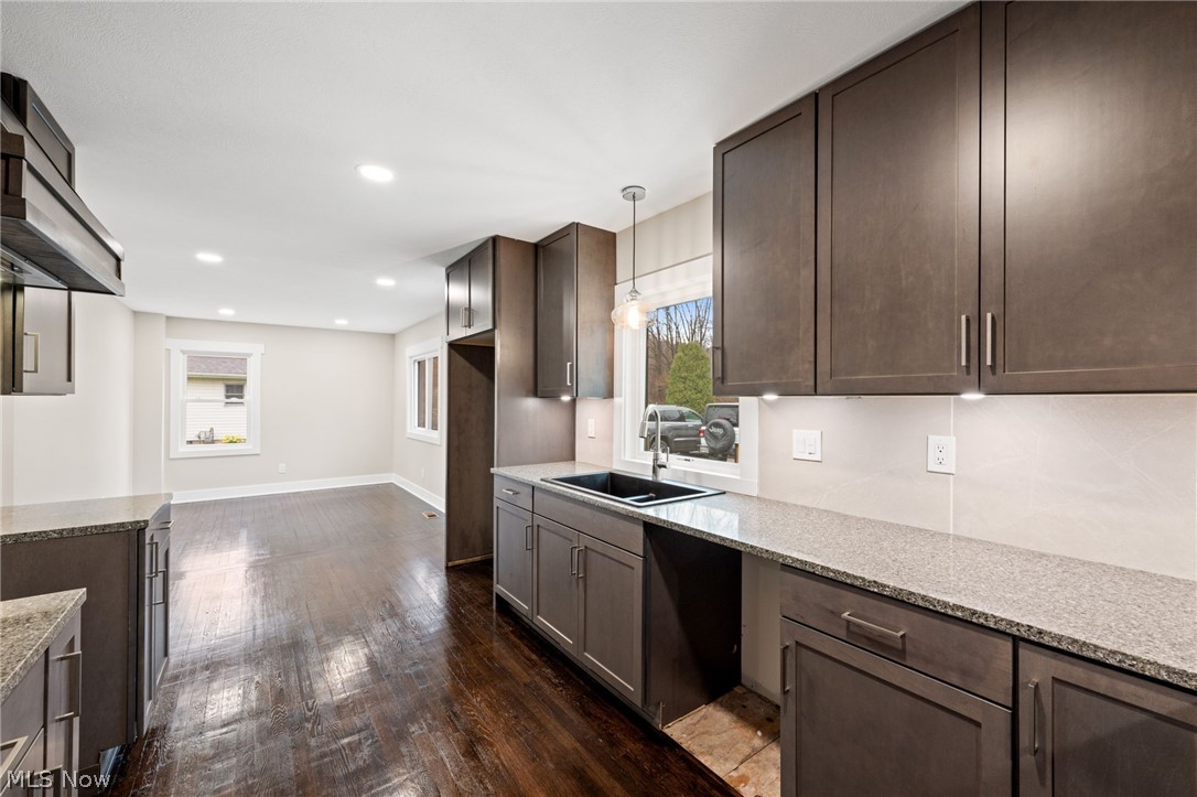 3679 Call Road Perry, OH 44081 - Photo 11 of 41 Kitchen featuring dark brown New cabinets, dark hardwood flooring