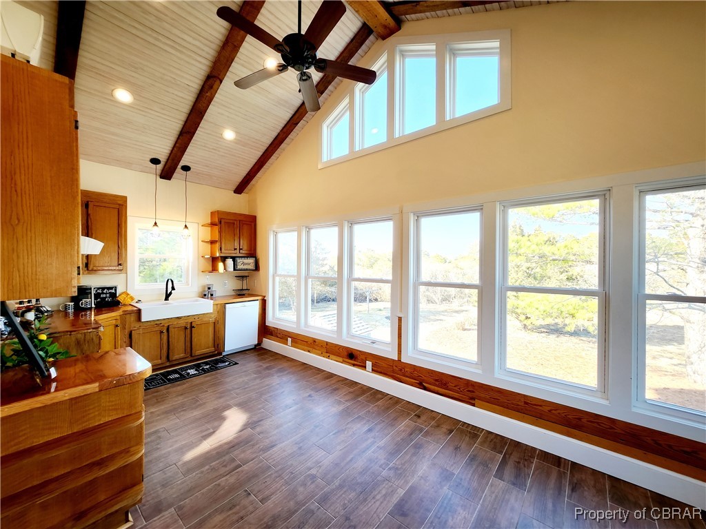 10013 Bonniville Road Hayes, VA 23072 - Photo 9 of 27 Kitchen with beamed ceiling and wall of windows