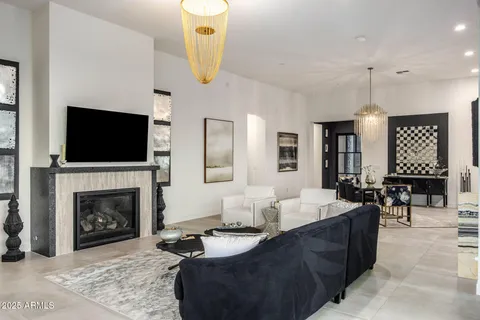 a kitchen with stainless steel appliances granite countertop a sink refrigerator and cabinets