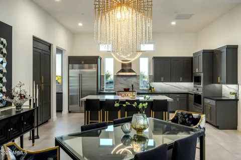 a kitchen with sink cabinets and stainless steel appliances