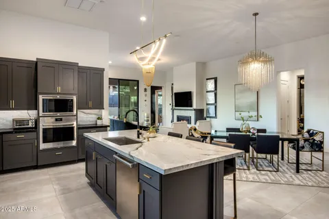a kitchen with a stove and a sink