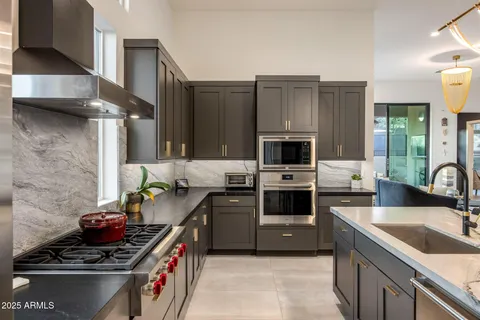 a room with a window and cabinets