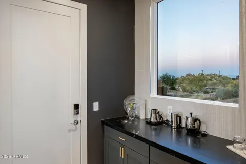 a utility room with sink dryer and washer