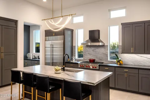 a kitchen with a table and chairs in it