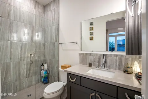a view of a patio with couches and potted plants