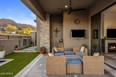 a view of living room filled with furniture and a flat screen tv