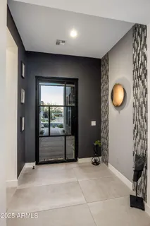 a dining room with furniture and chandelier kitchen view