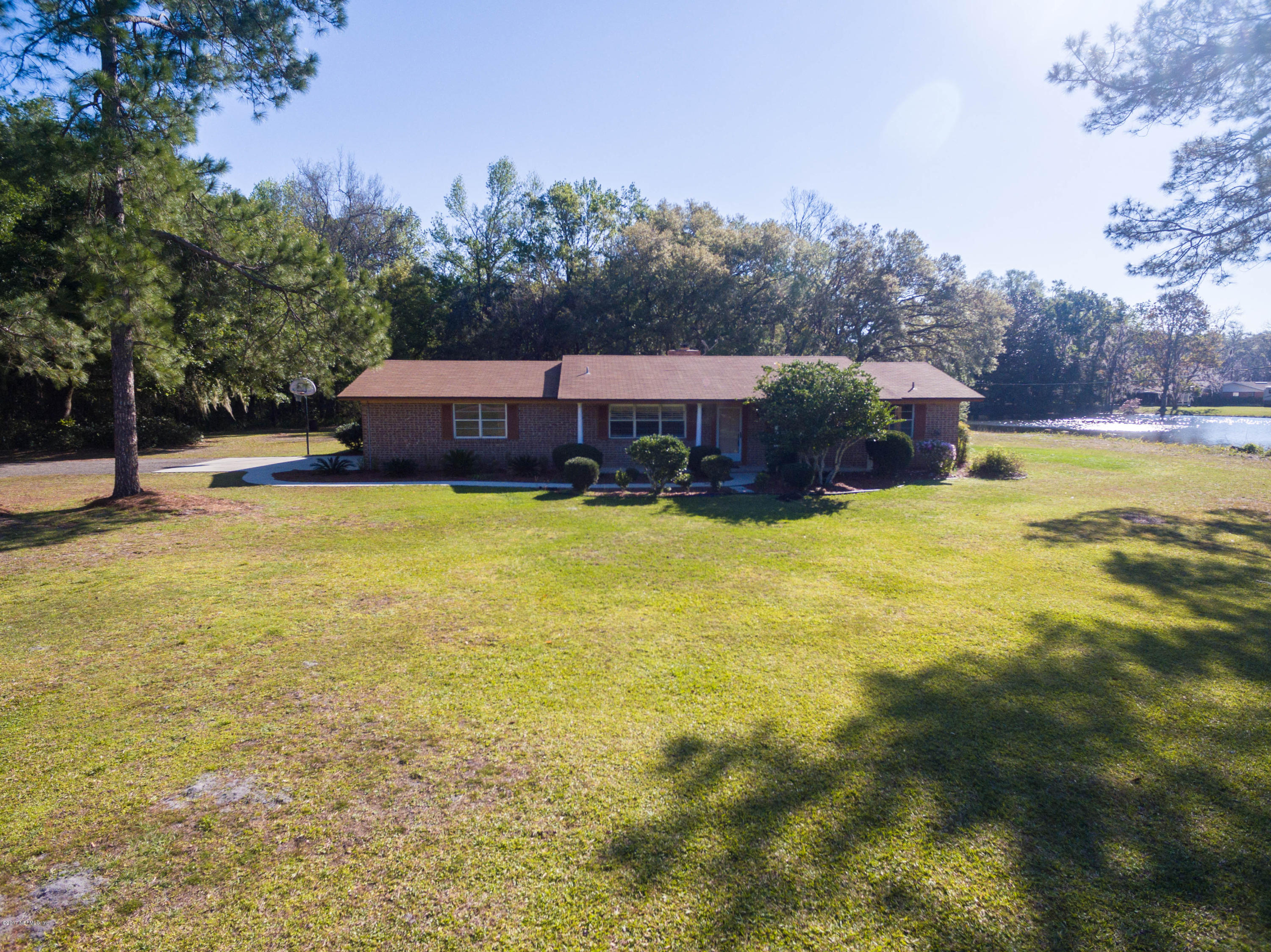 289 Holly Knowe Road Fleming Island, FL 32003 - Photo 2 of 45 Front View with Pond and Preserve