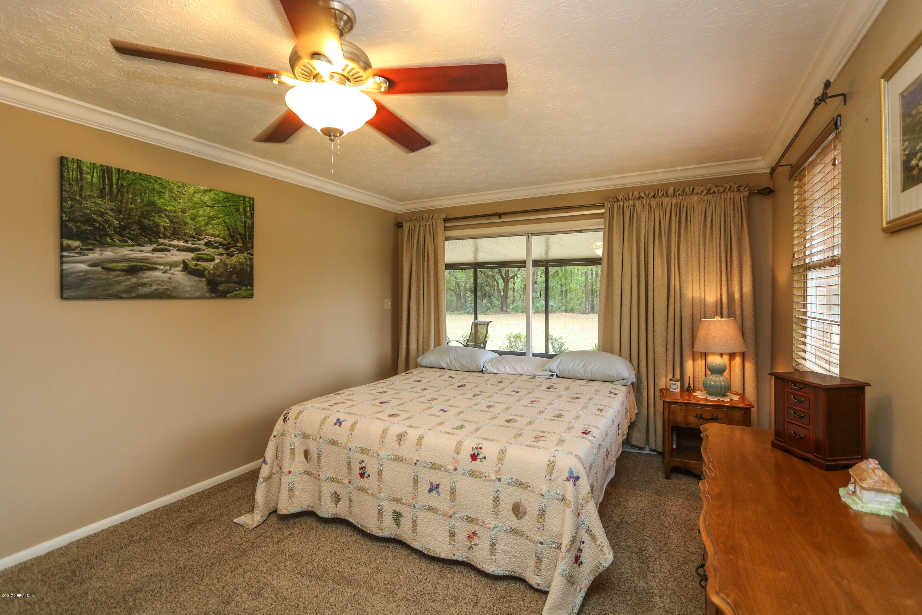 289 Holly Knowe Road Fleming Island, FL 32003 - Photo 34 of 45 Master Bedroom Open to Patio