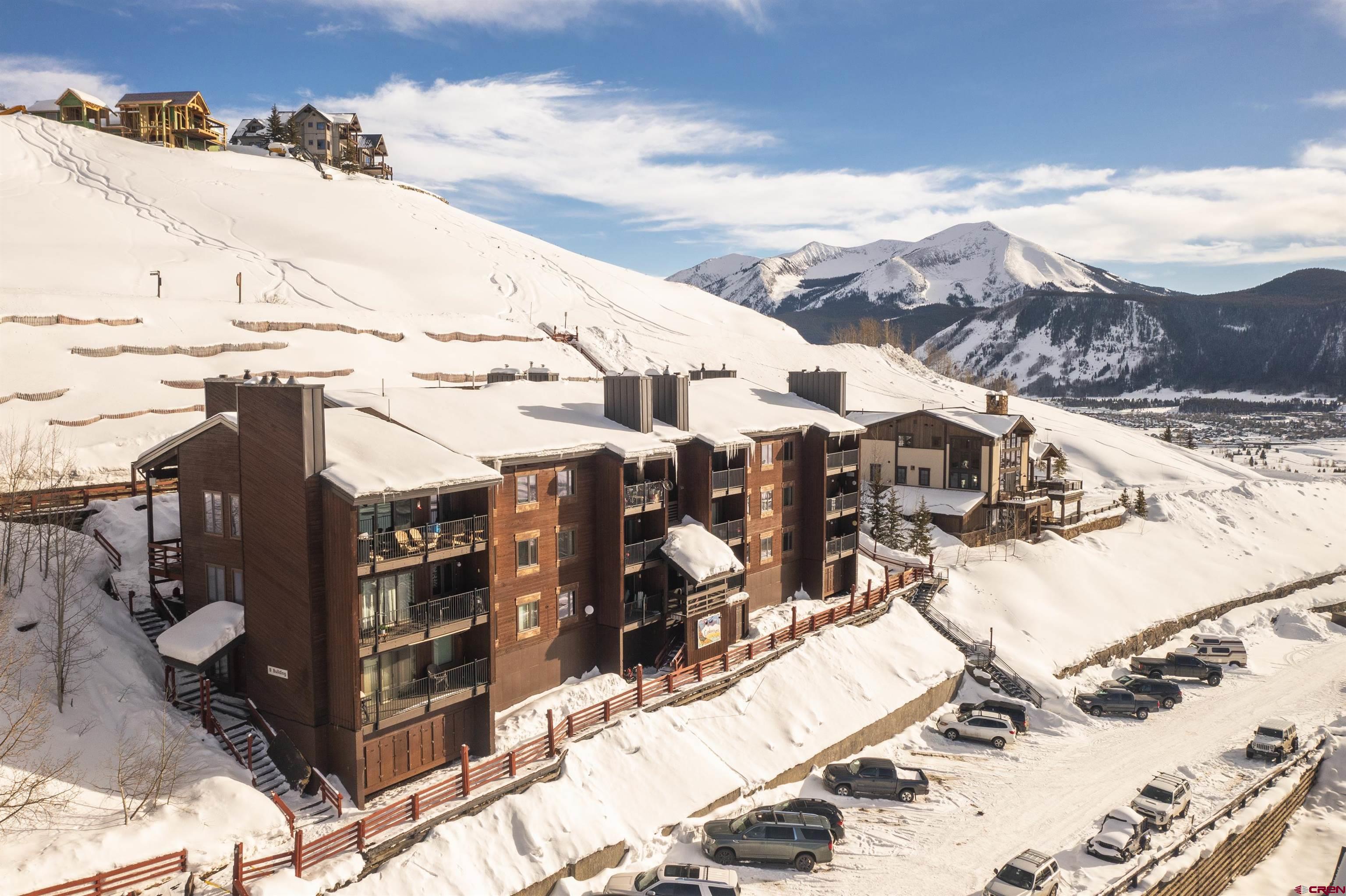 32 Hunter Hill Road, Unit B102 Crested Butte, CO 81225 - Photo 26 of 28 a view of a house with a yard