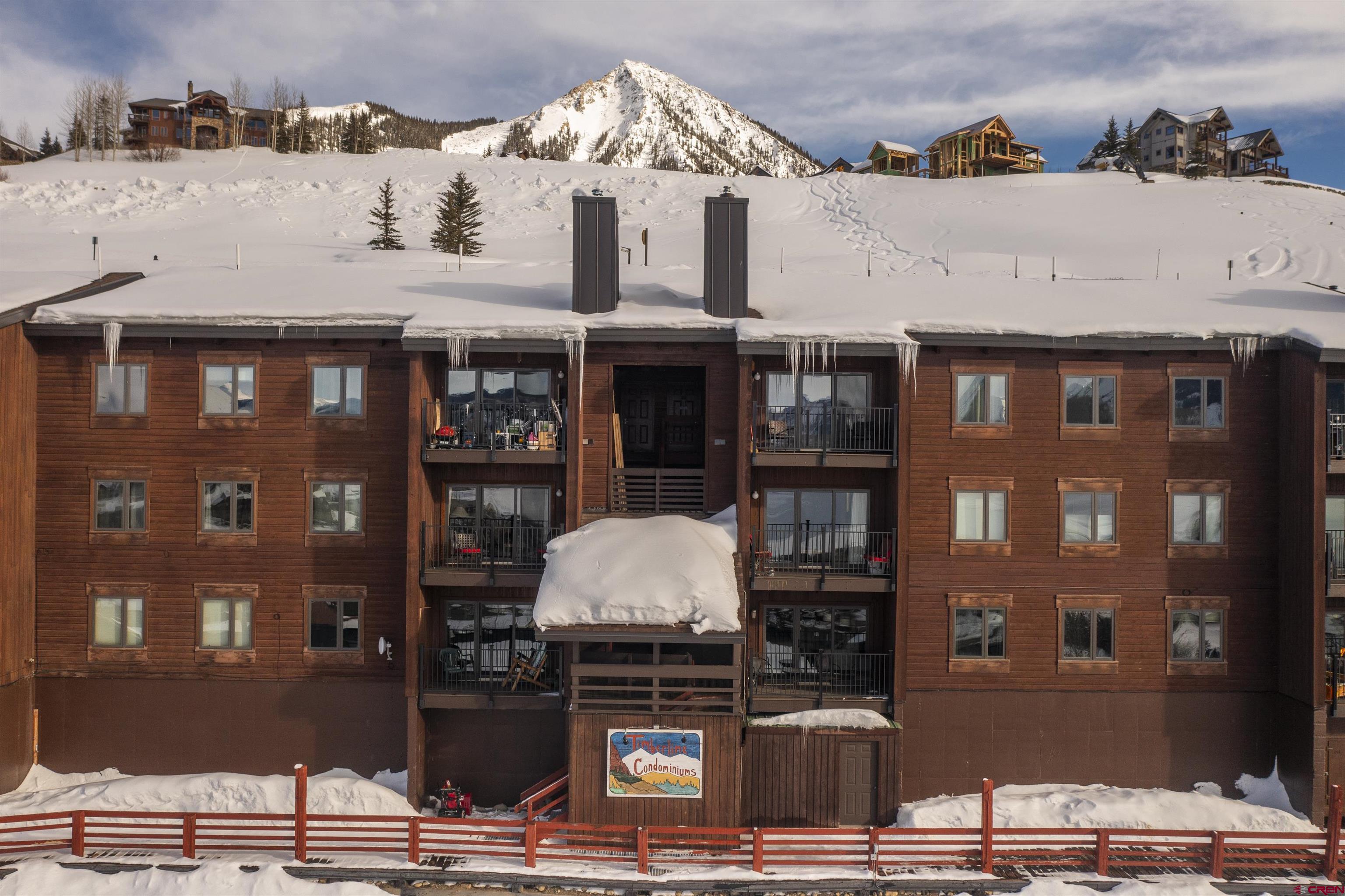 32 Hunter Hill Road, Unit B102 Crested Butte, CO 81225 - Photo 28 of 28 a front view of a building with glass windows