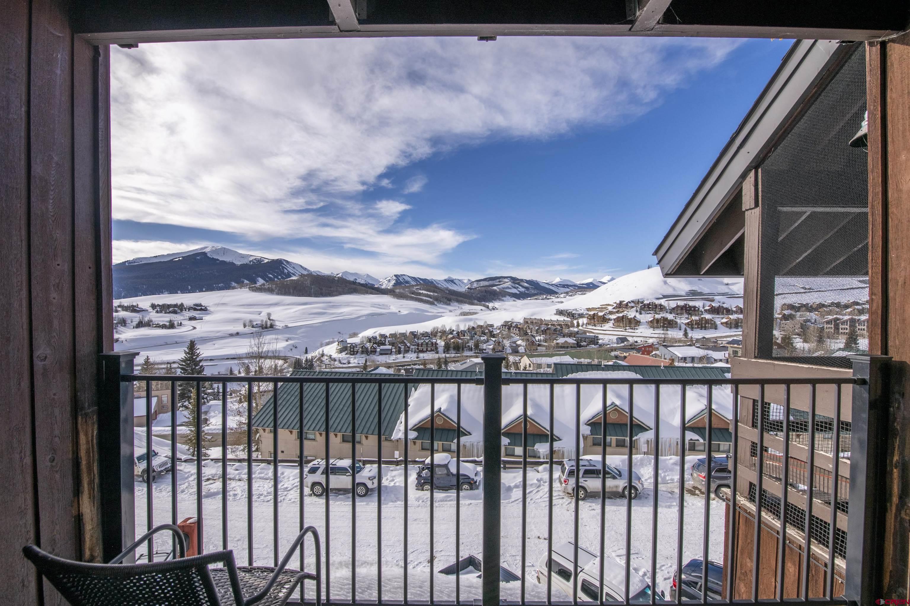 32 Hunter Hill Road, Unit B102 Crested Butte, CO 81225 - Photo 7 of 28 a view of a balcony with wooden fence