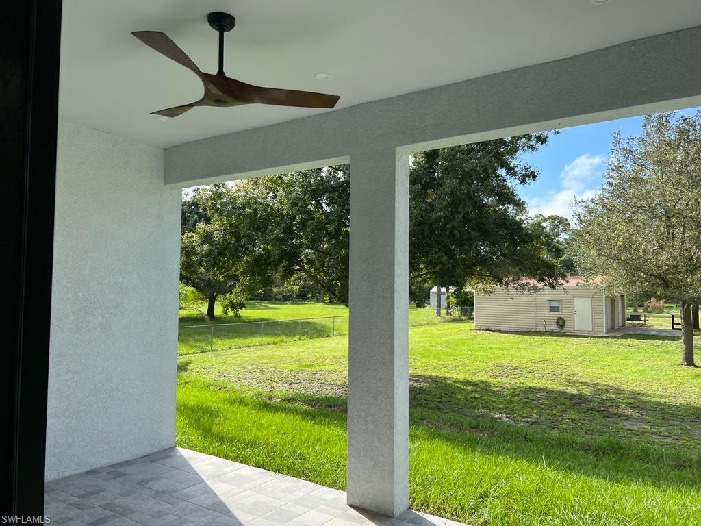 3302 East 3rd Street Lehigh Acres, FL 33936 - Photo 20 of 23 a view of a living room and floor to ceiling window