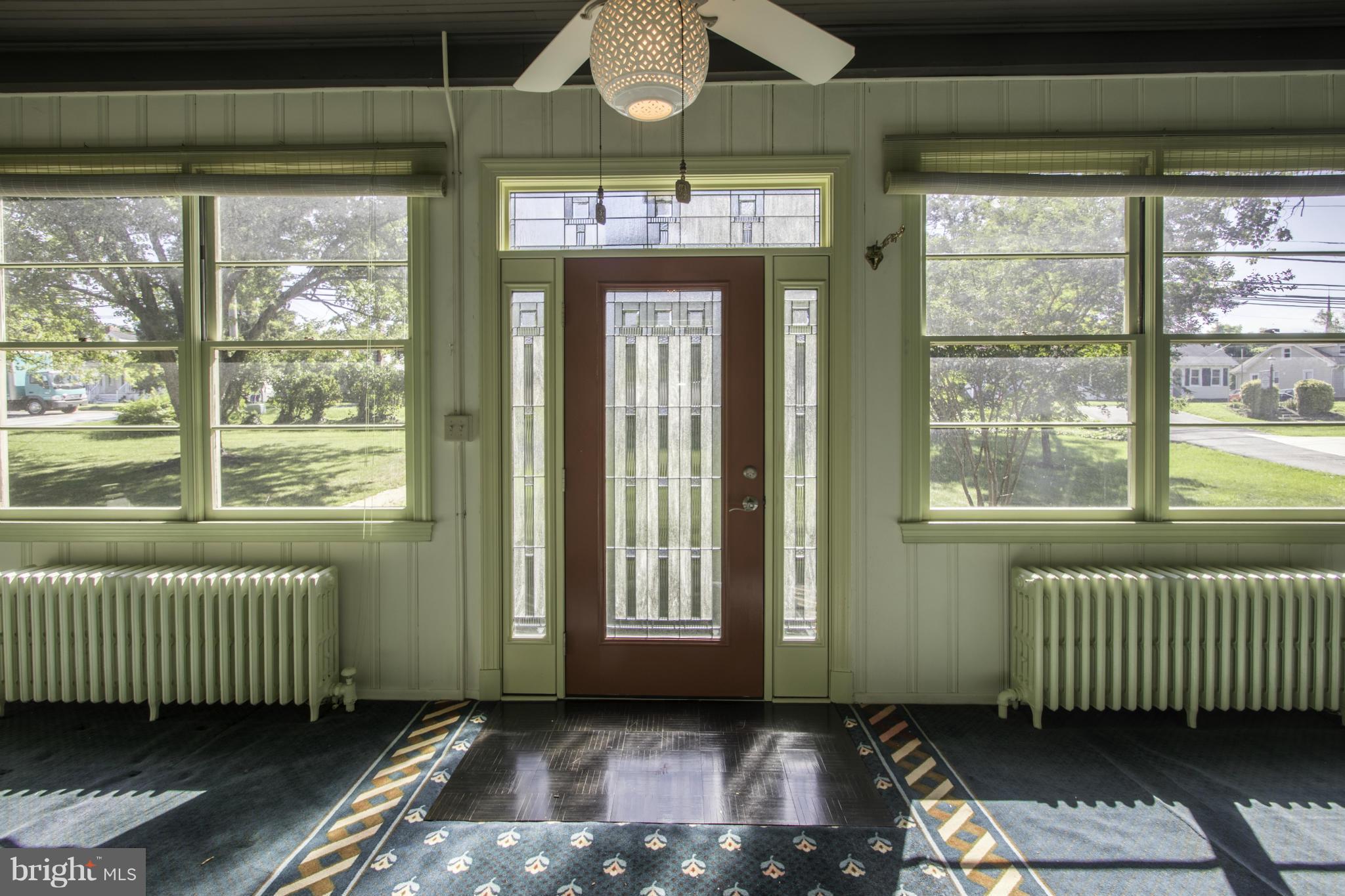 a view of a room with a window and balcony