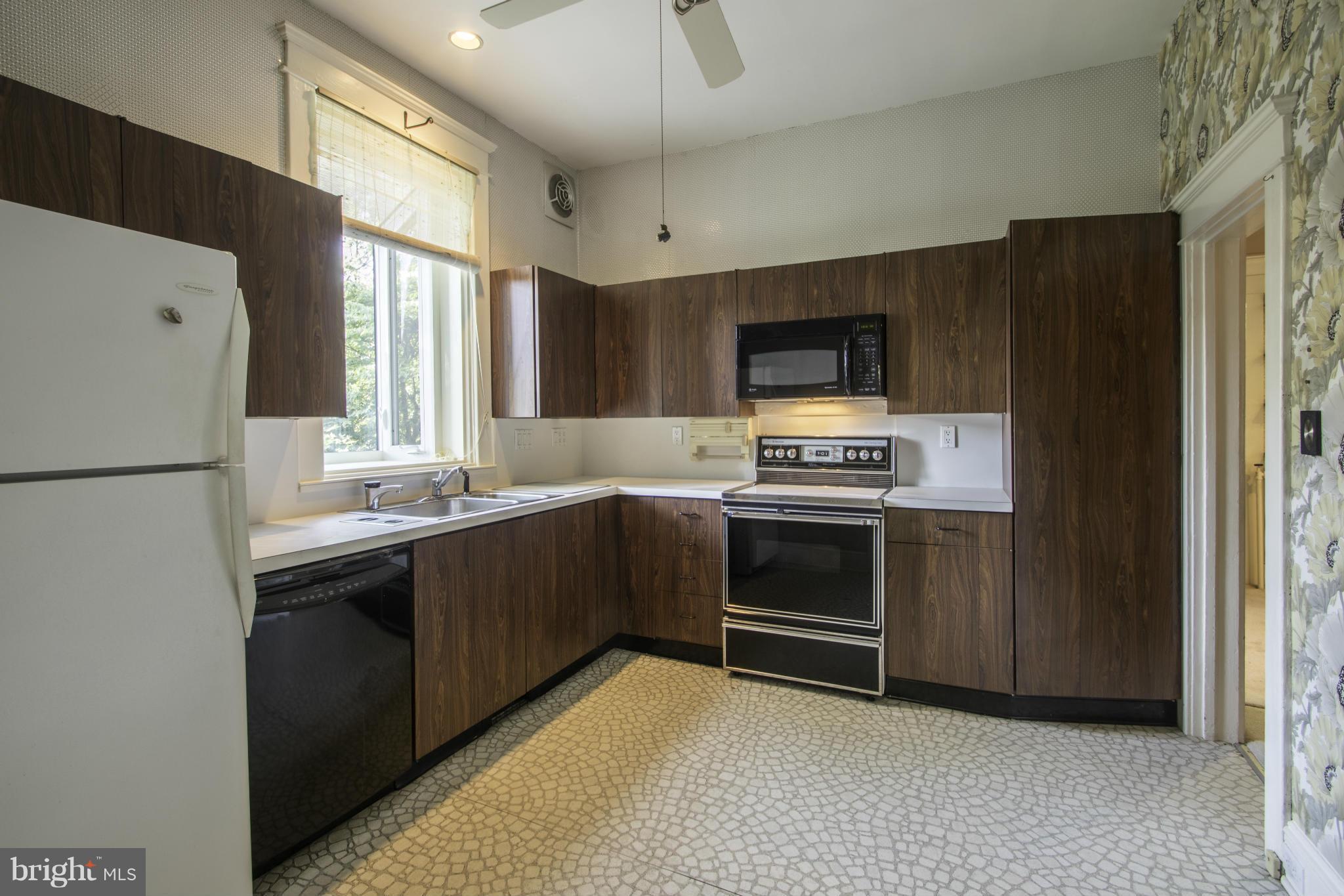 112 North Hammonds Ferry Road Linthicum Heights, MD 21090 - Photo 11 of 30 a kitchen with stainless steel appliances a stove sink and refrigerator