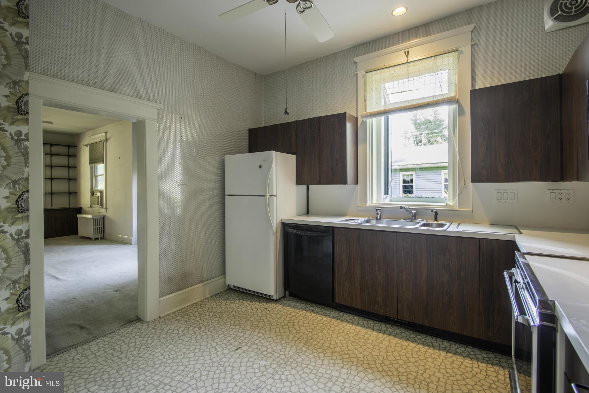 112 North Hammonds Ferry Road Linthicum Heights, MD 21090 - Photo 13 of 30 a kitchen with refrigerator and window