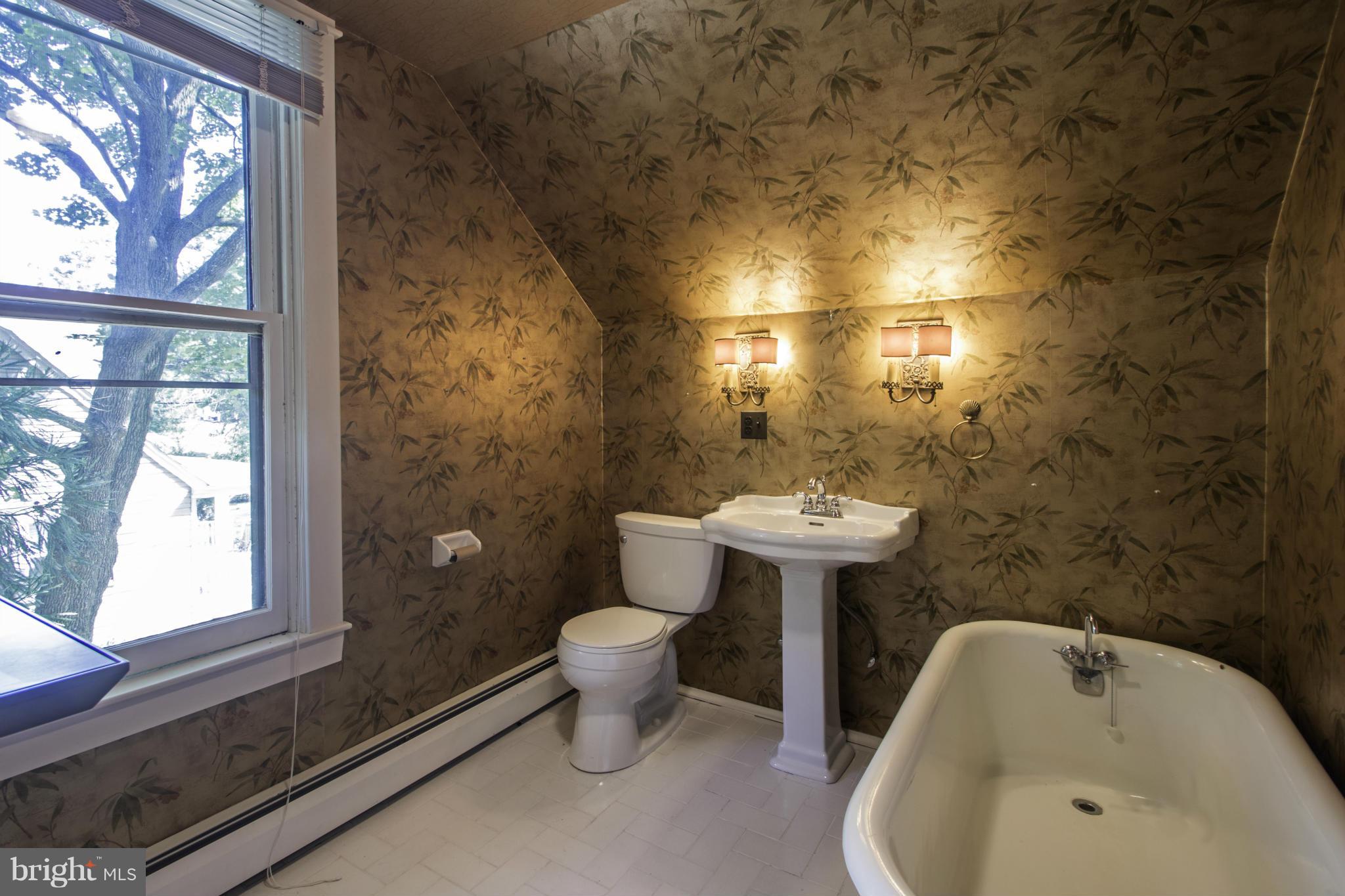 112 North Hammonds Ferry Road Linthicum Heights, MD 21090 - Photo 18 of 30 a bathroom with a sink and a bathtub