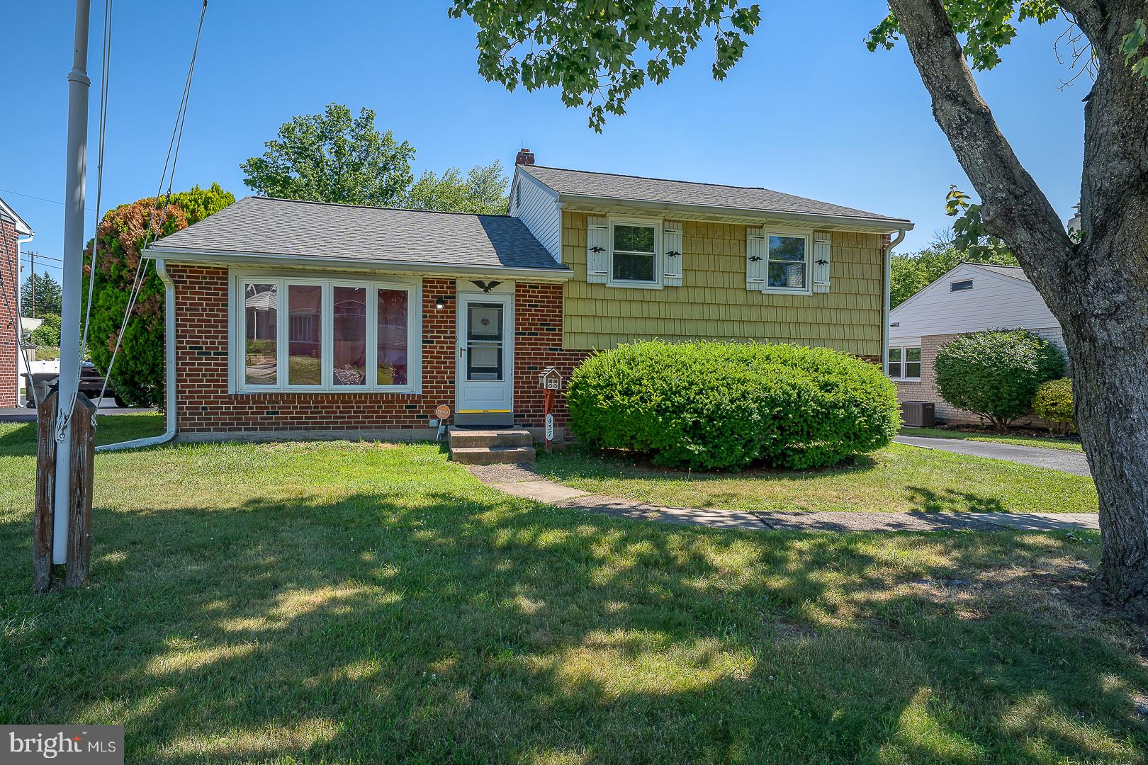 437 Rittenhouse Circle Havertown, PA 19083 - Photo 1 of 55 Charming brick home with lush greenery.