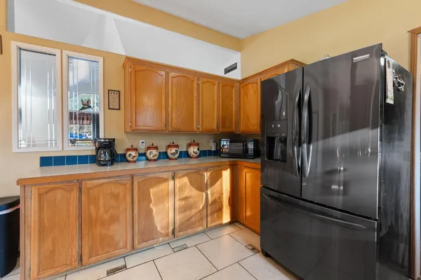 a kitchen with stainless steel appliances granite countertop a sink and a stove