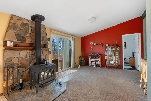 a living room with furniture and a floor to ceiling window