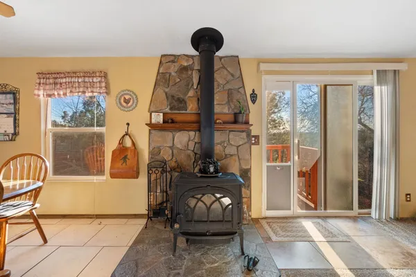 a view of a livingroom with furniture and a floor to ceiling window