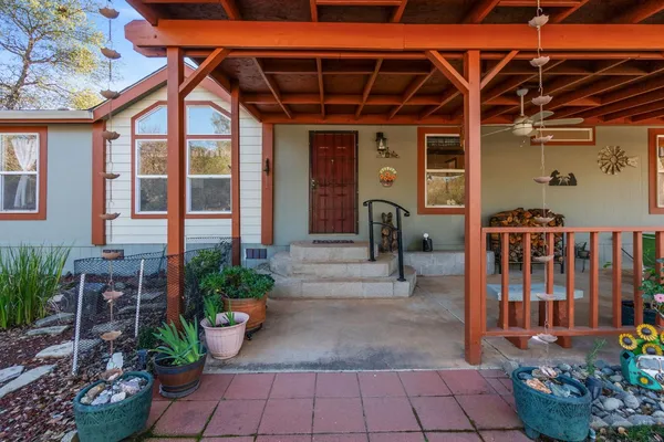 a front view of a house with garden