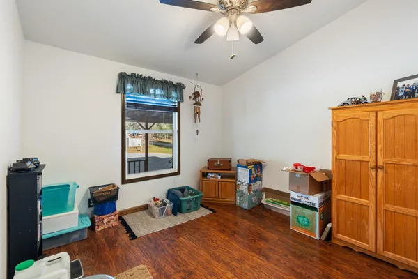 a view of a chairs and table in a patio