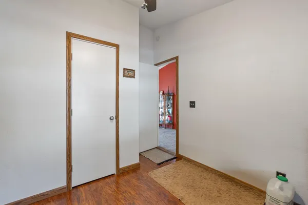 a view of a big house with a big yard and large trees