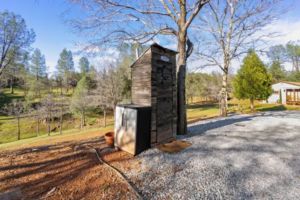 a view of a yard with a fountain