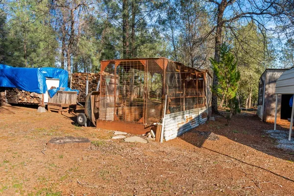 a view of outdoor space with deck and trees