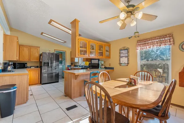 a kitchen that has a sink and a stove top oven