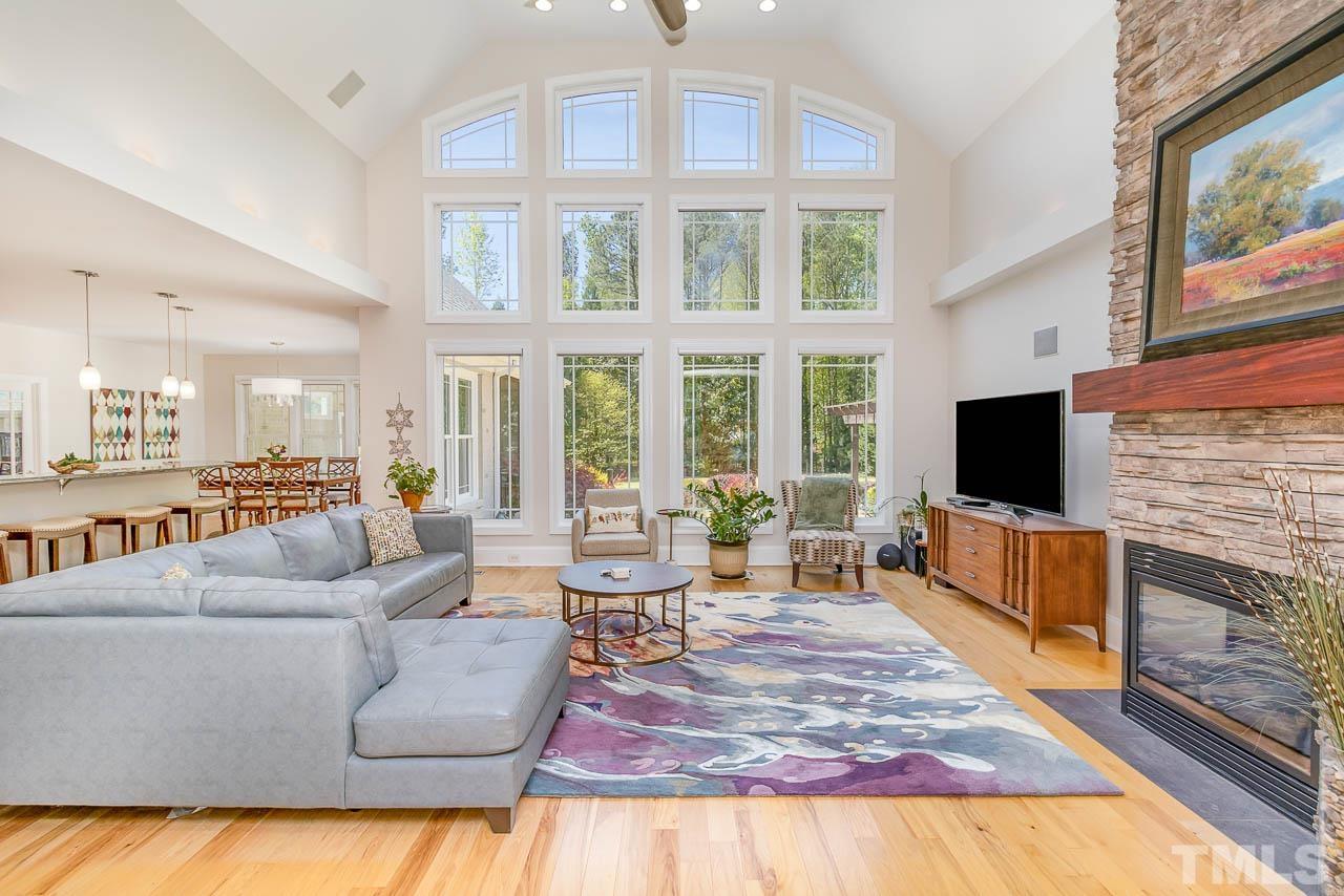 412 Deep Woods Trail Wake Forest, NC 27587 - Photo 25 of 35 a living room with fireplace furniture and a flat screen tv