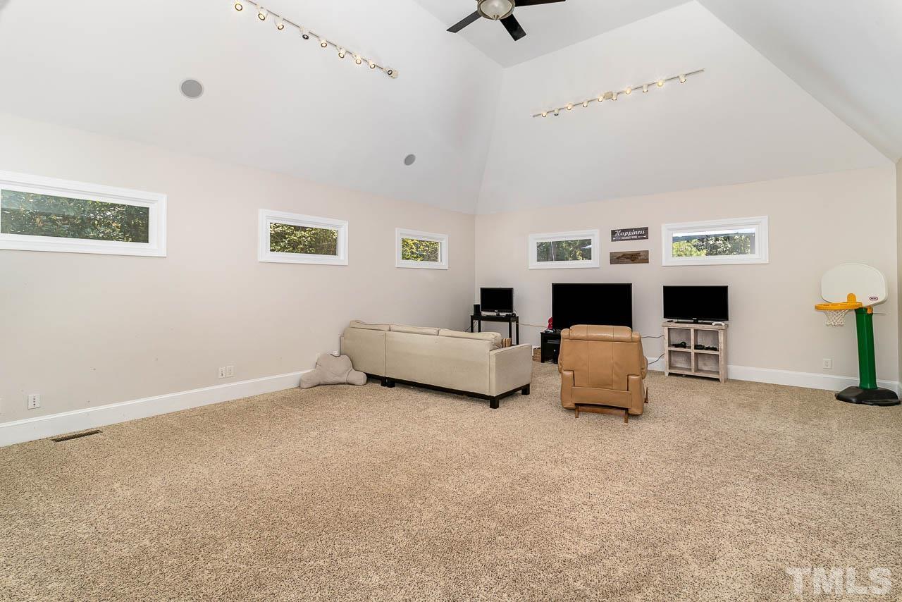 412 Deep Woods Trail Wake Forest, NC 27587 - Photo 33 of 35 a living room with furniture and a fireplace