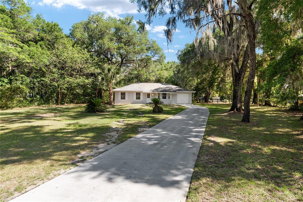 4329 Northwest 155th Street Reddick, FL 32686 - Photo 3 of 52 a view of a house with yard and sitting area