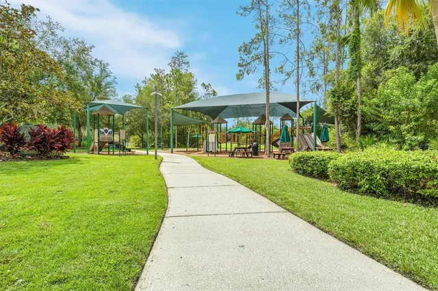 a front view of a multi story building with community park