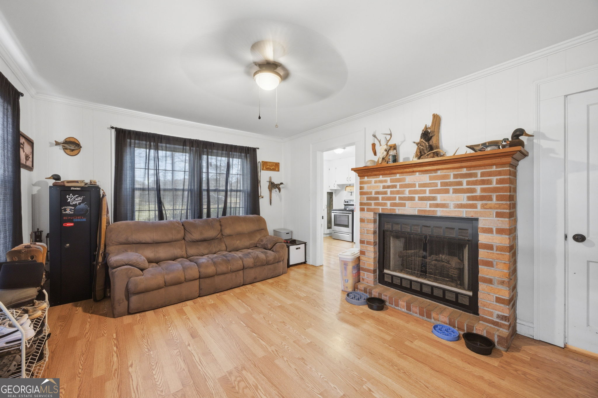 176 Childs Street Gray, GA 31032 - Photo 11 of 22 a living room with furniture and a fireplace