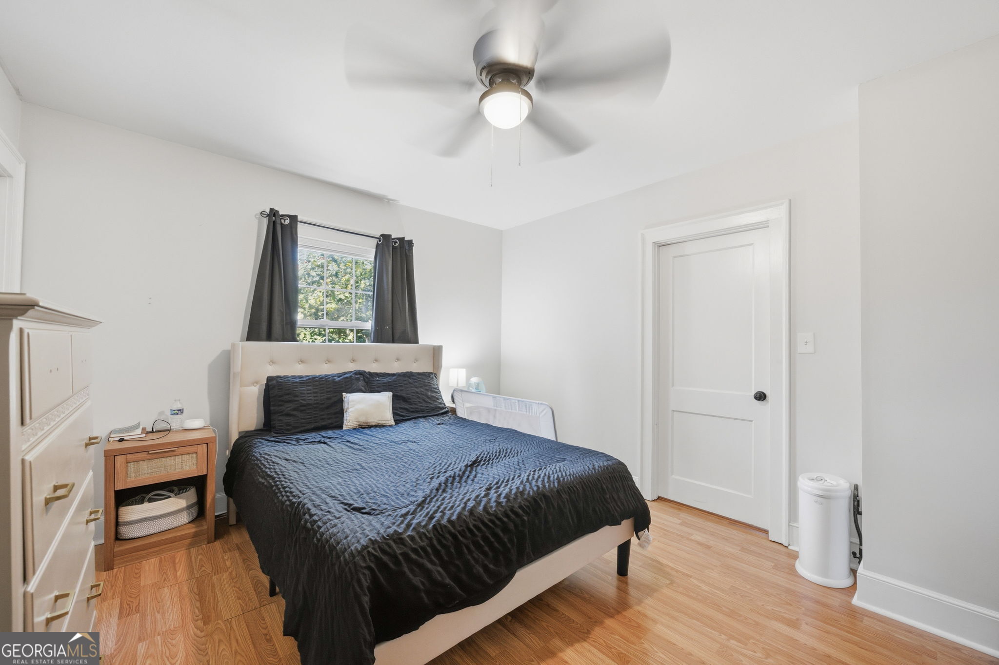 176 Childs Street Gray, GA 31032 - Photo 12 of 22 a bedroom with a large bed and a chandelier