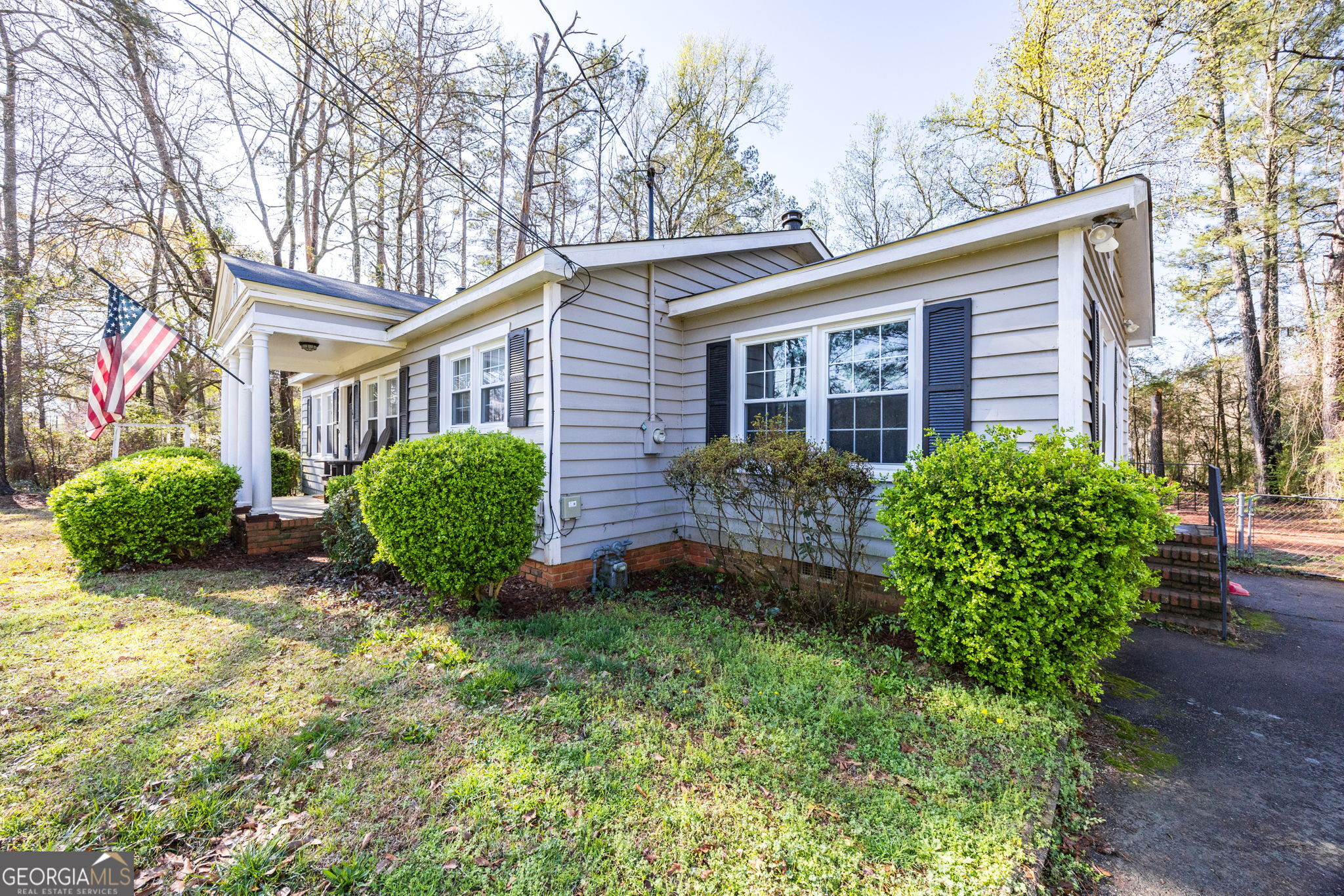 176 Childs Street Gray, GA 31032 - Photo 19 of 22 a view of a house with a big yard and large trees