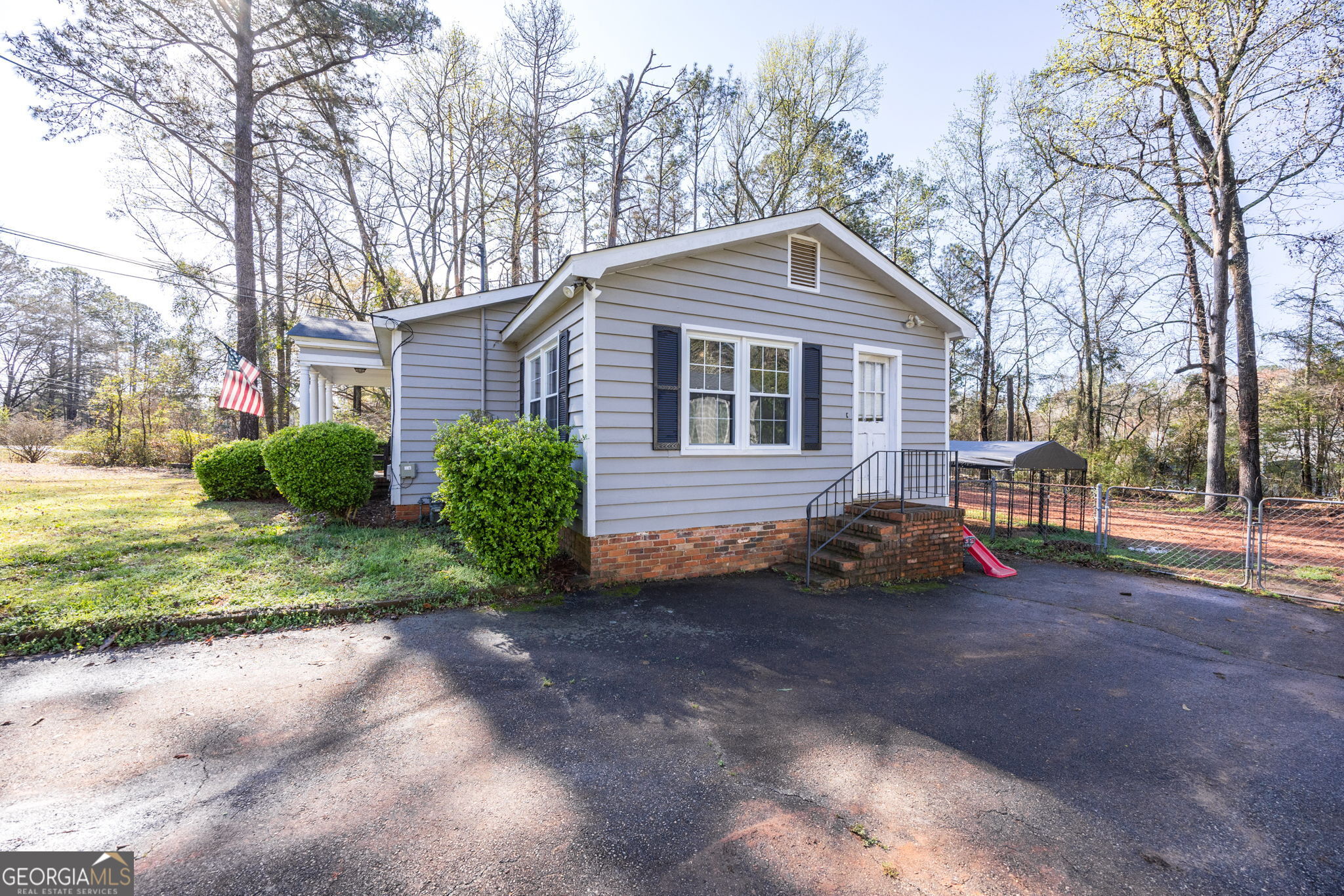 176 Childs Street Gray, GA 31032 - Photo 20 of 22 a front view of a house with a garden