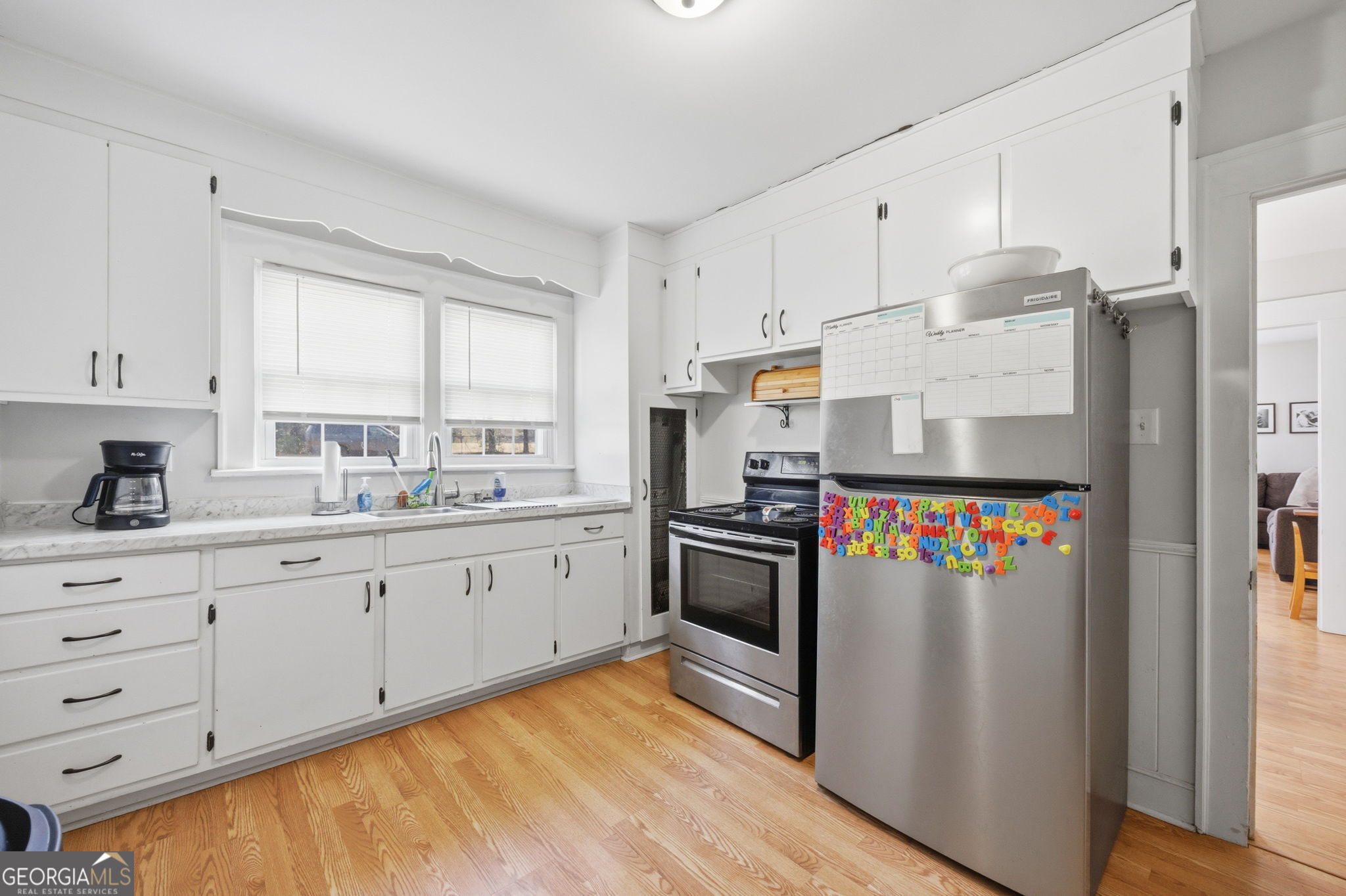176 Childs Street Gray, GA 31032 - Photo 8 of 22 a kitchen with stainless steel appliances granite countertop a refrigerator and a stove top oven