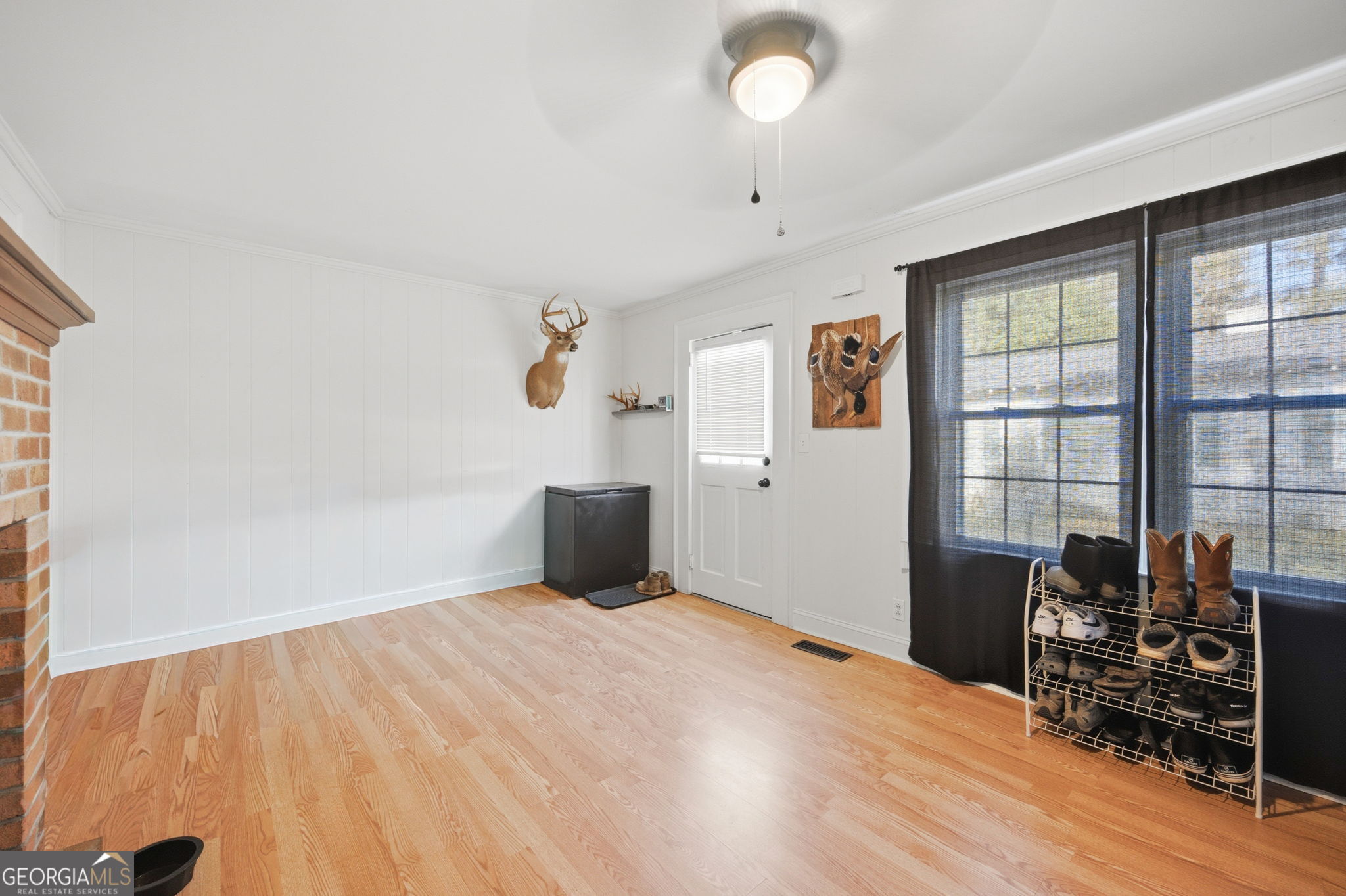 176 Childs Street Gray, GA 31032 - Photo 10 of 22 a big room with wooden floor and windows