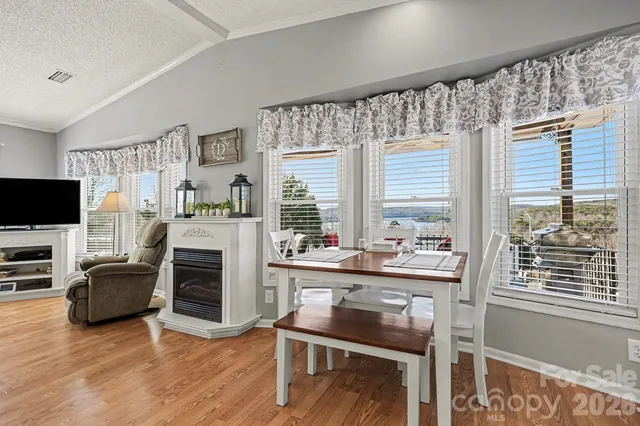a view of a livingroom with furniture and a flat screen tv