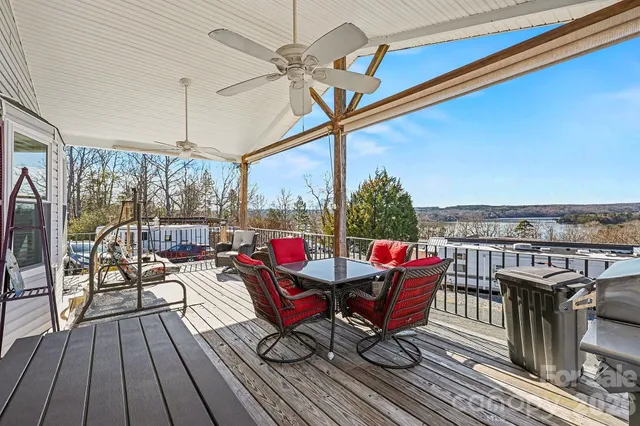 a roof deck view with a table and chairs