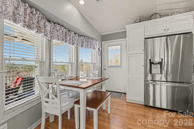 a dining room with furniture and wooden floor