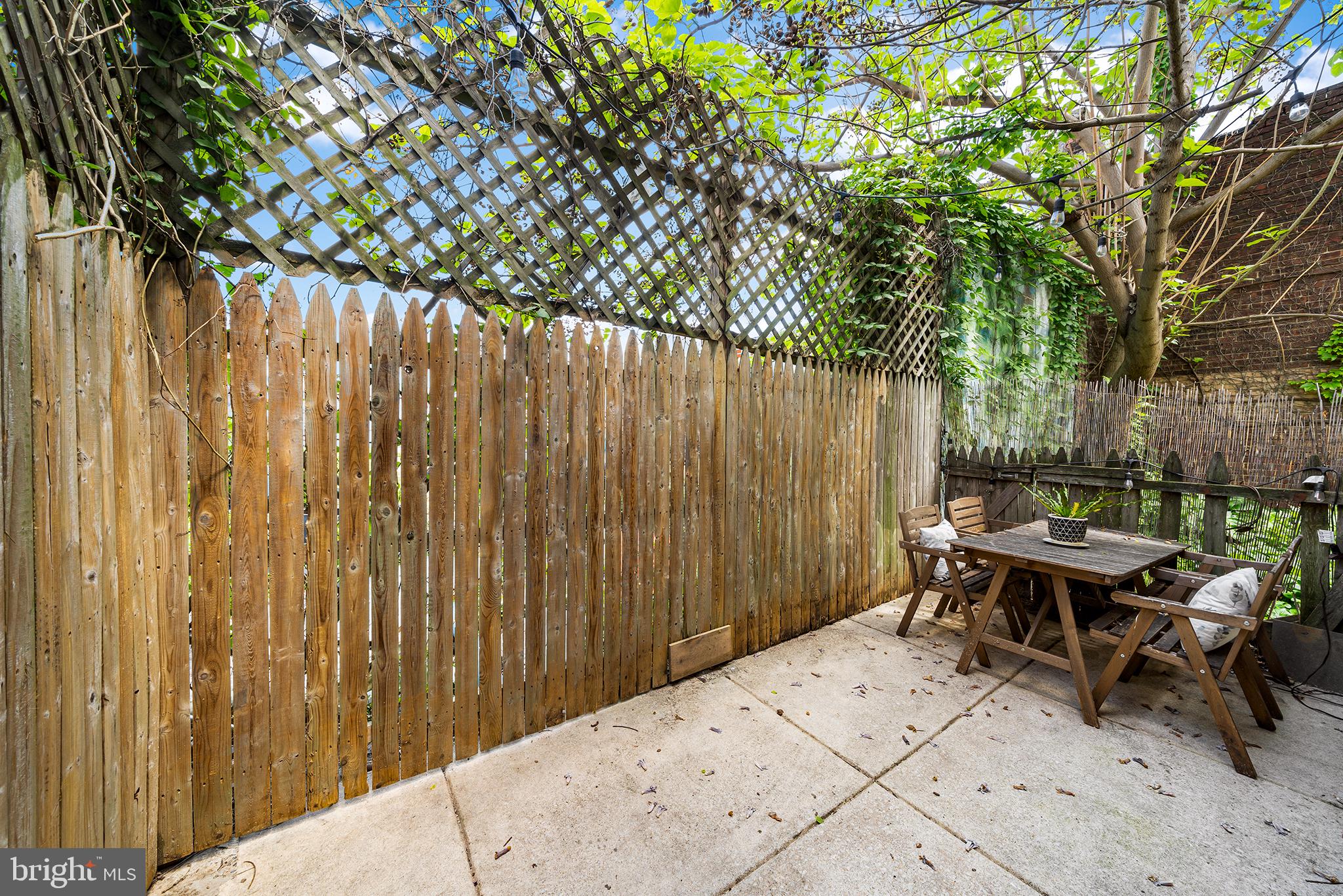 107 Master Street Philadelphia, PA 19122 - Photo 13 of 24 a view of backyard with a table and chairs