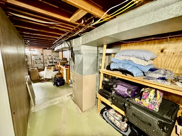 a bed room with a bed and a night stand