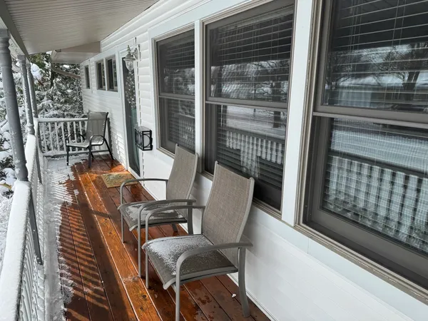 a view of a balcony with furniture